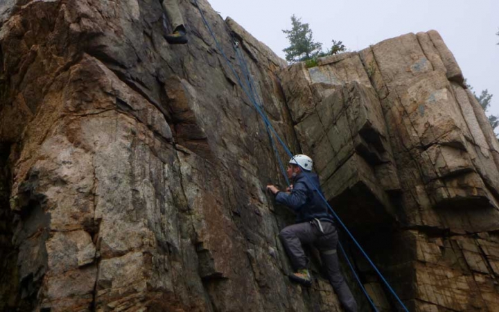 adults unplug rock climbing in maine